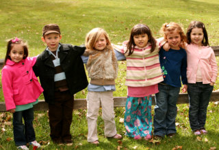 group of children showing their genuine smile